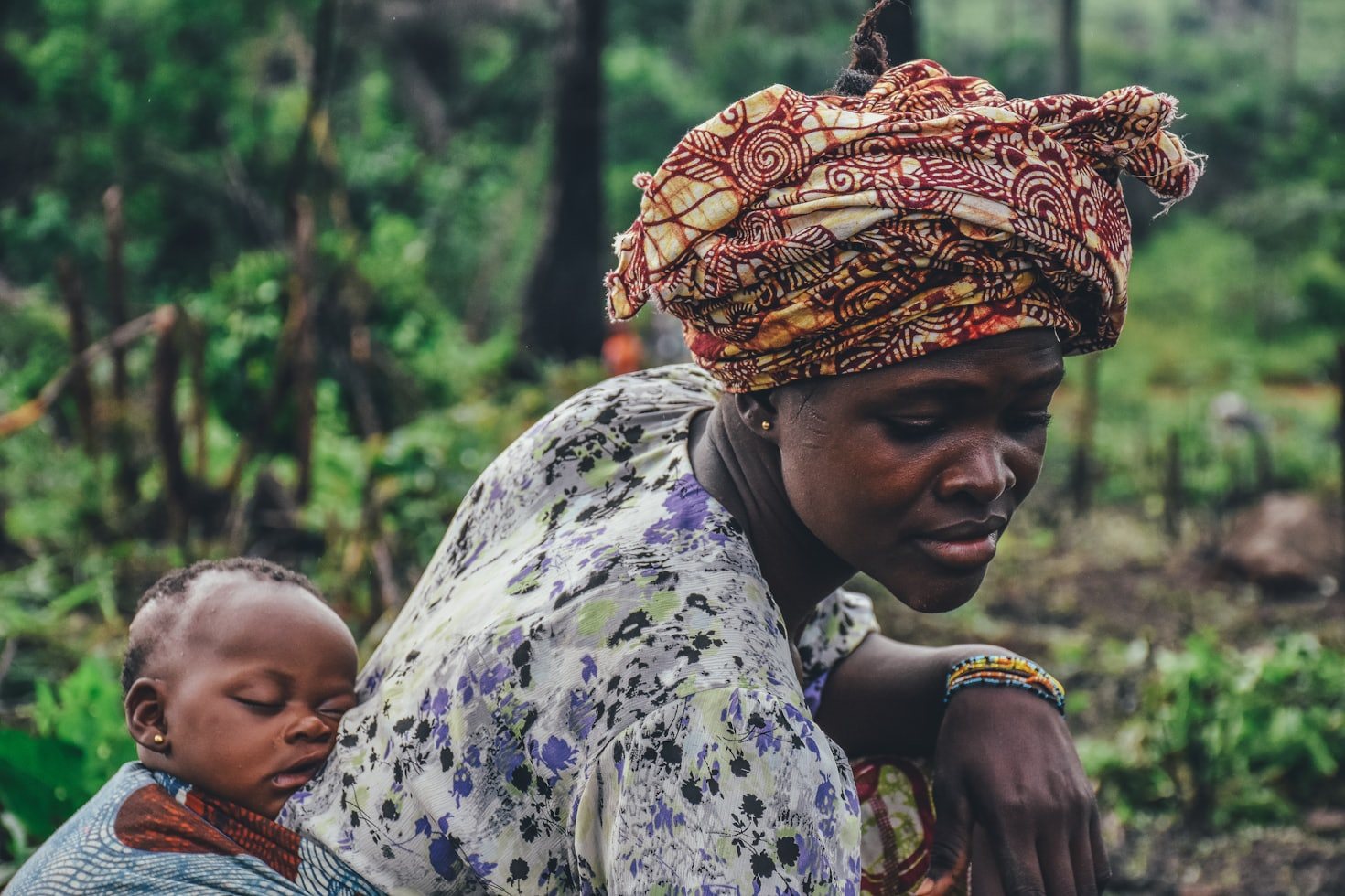 Woman with a child in a rural agricultural setting